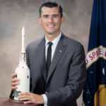 Roger Chaffee with a spacecraft model.