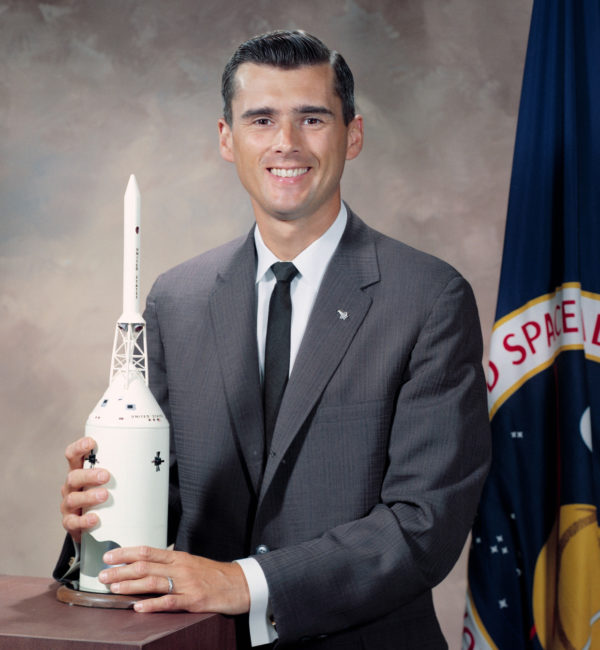 Roger Chaffee with a spacecraft model.